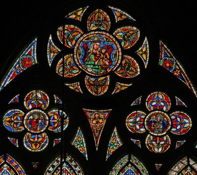 Window w207 depicting the tracery lights with two angels and the Virgin and Child by French School
