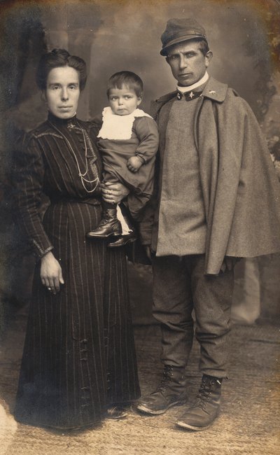 Postcard with an Infantry Soldier, Gunner, in the Uniform of War with His Family by G. Negri
