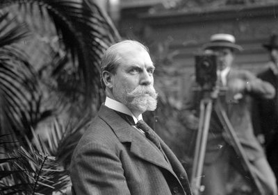 Charles E. Hughes on camera by George Grantham Bain