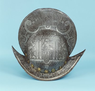 A comb morion, etched with cherub heads, sphinxes and winged horses, the centre with a pseudo classical warrior in contemporary armour with sword and shield by German School
