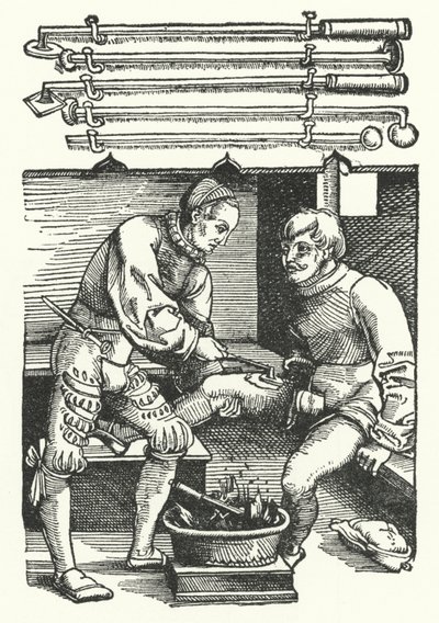A surgeon cauterising a soldier