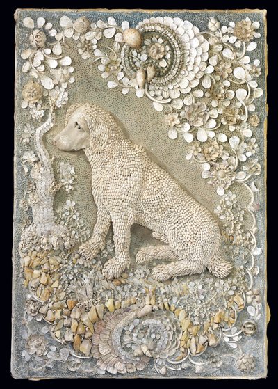 One of a pair of Louis XV seated dogs modelled in relief, within a grotto-like surround by German School