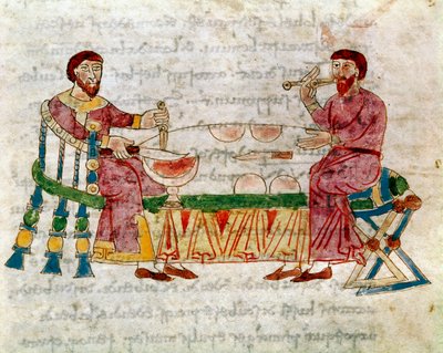 Two men at a table during a meal taken from the volume De Mensis et Escis, manuscript De Universo (or De rerum naturis (De la Nature des choses)) by Rabanus Maurus Magnentius (ca. 780-856). 9th century. by German School