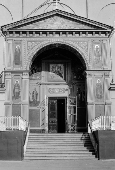 Entrance to a Russian Orthodox church with icons decorating exterior walls by Gilbert H. Grosvenor