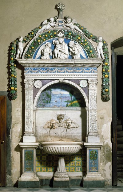 Decorated fountain with a high relief in marble and terracotta by Giovanni della Robbia. Sacristy of Santa Maria Novella, Florence by Giovanni della Robbia