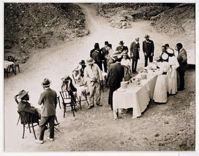 Distinguished visitors taking refreshments near the Tomb of Tutankhamun at the opening of the inner chamber, Valley of the Kings by Harry Burton