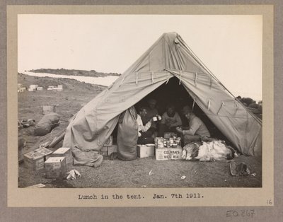 Four Expedition Members Having Lunch in a Tent by Herbert Ponting