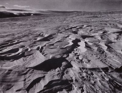 The great waves of frozen snow thrown up by the wind by Herbert Ponting