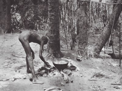 Africa: Nuer Cooking Crocodile Meat by Hugo Adolf Bernatzik