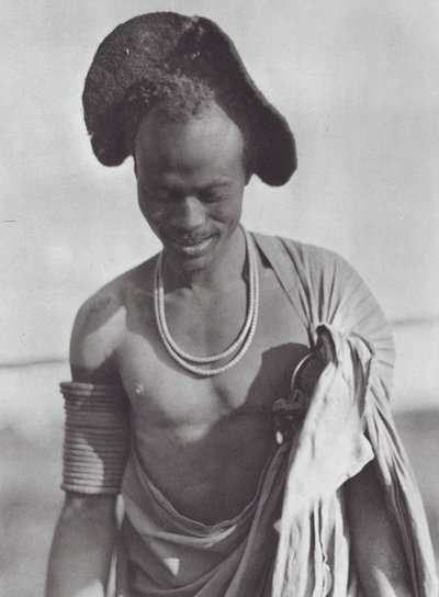 Africa: Shilluk warrior with hood coiffure by Hugo Adolf Bernatzik