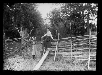 Lilli and Elsa Simberg at the Gate on Niskapohja Road by Hugo Simberg