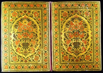 A pair of lacquer bookcovers decorated with a floral design, with a flower vase and finches at the centre, 18th century by Indian School