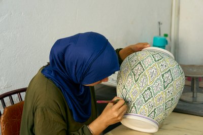 Woman at work at a ceramic factory in Fez, Morocco (photo) by Ira Block