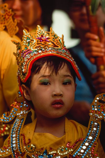 A Young Worshipper at the Tabaung Festival, Shwe Dagon Pagoda, Rangoon, Burma by James L Stanfield