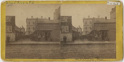 View of John R. Walsh Periodicals store on Madison Street, Chicago with the Post Office in the background, 1869 by John Carbutt