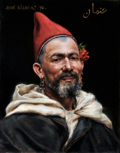 Head of Moroccan Portrait of Man with Pierced Ears and Red Hat, with a Flower in the Ear and a Tattoo on the Temple 1892 by Jose Silbert