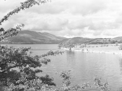 A view across Crummock Water with fells in the background by Joseph Hardman
