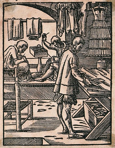 A tailor cutting cloth with scissors while his colleagues sew at a bench. Woodcut by J. Amman. by Jost Amman