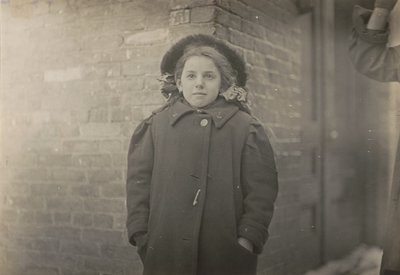Mery Horn, a hunchback condition aggravated by the heavy load of papers she carried. Hartford, Connecticut, March 1909 by Lewis Hine