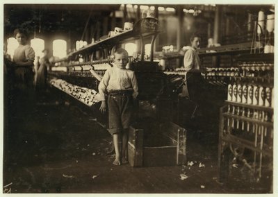 8 Year Old Leo, Only 4 Feet Tall, Picks Up Bobbins for 15 Cents a Day at Elk Cotton Mills, Fayetteville, Tennessee, 1910 by Lewis Wickes Hine