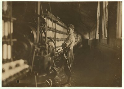 John Dempsey, 11 or 12 Years Old, Saturday Worker in the Mule-Spinning Room at Jackson Mill, Fiskeville, Rhode Island (1909) by Lewis Wickes Hine