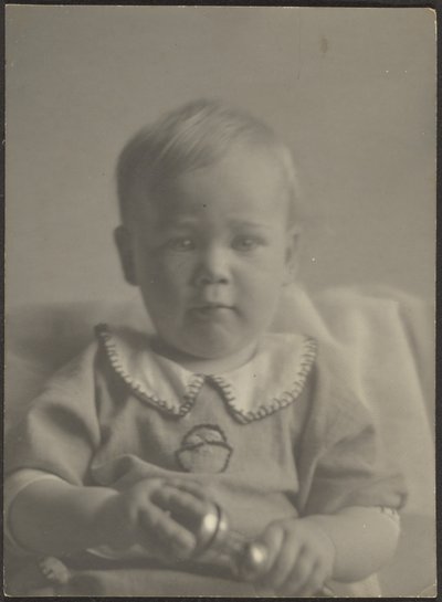 Baby Holding a Silver Rattle by Louis Fleckenstein