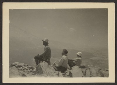Hikers Seated on Rocks by Louis Fleckenstein
