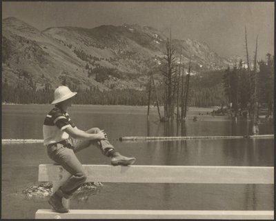 Man Sitting on Bench at Lake Side by Louis Fleckenstein