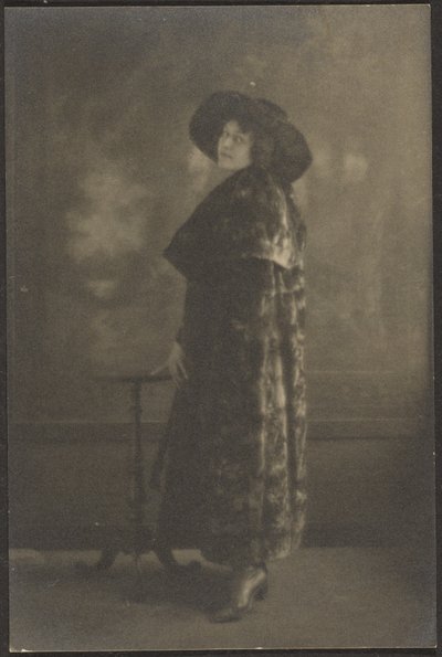 Portrait of Woman in Long Coat before Tapestry by Louis Fleckenstein