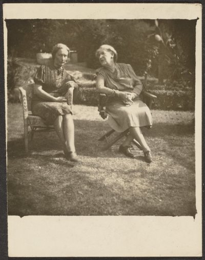 [Two Women Seated in Lawn Chairs] by Louis Fleckenstein