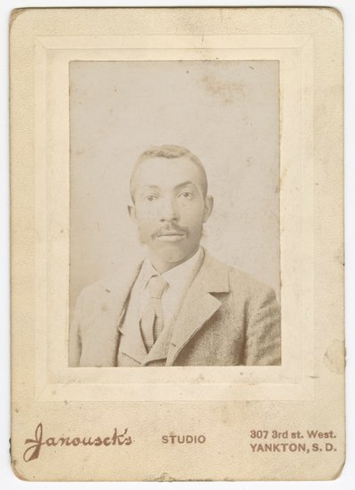 Photograph of a man wearing a light colored jacket, vest and necktie, late 19th century by Louis Janousek