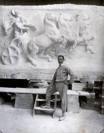 Full-Length Portrait of the Famous Sculptor Pietro Canonica. He is Posing in His Studio Before a Marble High Relief He is Working On (b/w photo) by Mario Nunes Vais