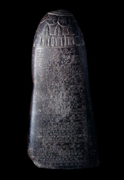 Kudurru in black limestone by King Marduk-sapik-zari (1082-1070 BC). Stele used as a support for donations of land made by the Kassite rulers of Babylon to family members or high dignitaries. The inscription is in cuneiform by Mesopotamian Mesopotamian