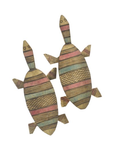 Carved wooden tortoise figures decorated with red, green and black painted geometric patterns, Hausa People, Kano, Northern Nigeria by Nigerian Nigerian