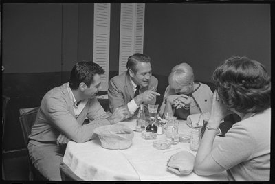 Paul Newman, Mort Sahl and Joanne Woodward Joking at Dinner by Orlando Suero