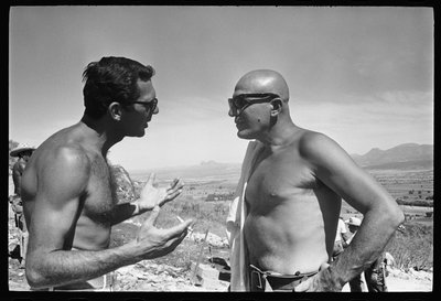 Sydney Pollack and Telly Savalas on set of 