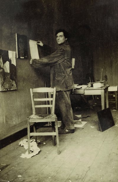 Amedeo Modigliani in His Studio, c.1915 by Paul Guillaume