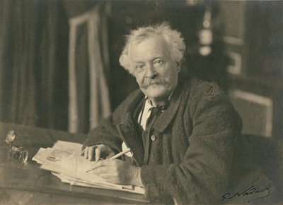 Félix Nadar seated at writing table by Paul Nadar