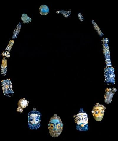 Necklace in glass paste with pendants depicting bearded heads, originally from Olbia, National Archeological Museum of Cagliari by Phoenician Phoenician