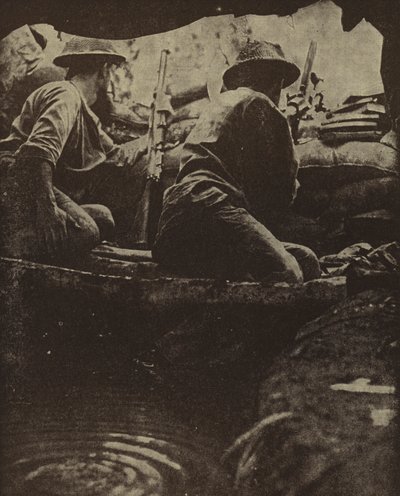 Australian soldiers in a water-filled rifle pit, Sanananda, New Guinea, World War II by Photographer Australian