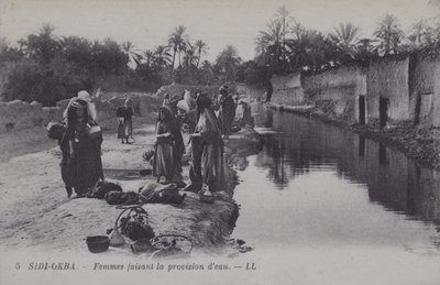 Women collecting water in Sidi-Okba, Algeria by Photographer French