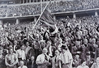 Italian fans supporting their athletes in the stadium at the Olympic Games, Berlin, Germany by Photographer German
