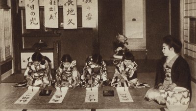 Japanese schoolgirls writing with brushes in a kindergarten class by Photographer Japanese