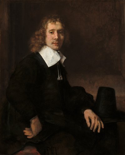 A Young Man Seated at a Table by Rembrandt van Rijn
