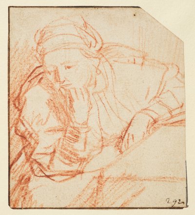 Saskia seated at a table by Rembrandt van Rijn