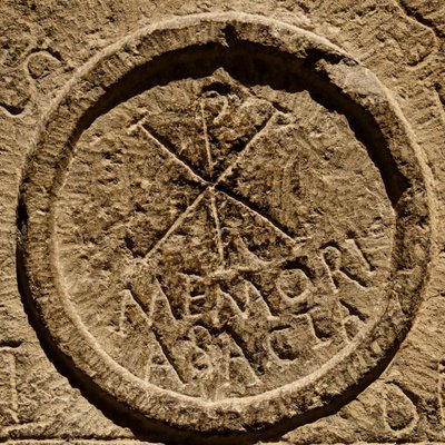 Detail from an altar stone depicting an abbreviation for the name of Jesus Christ by Roman
