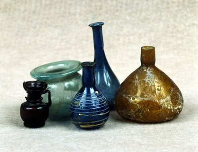 Glass bottles and vials containing perfumes, balms and ointments. Roman period. 1st century AD. by Roman