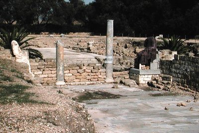 Ruins of a street with two statues by Roman