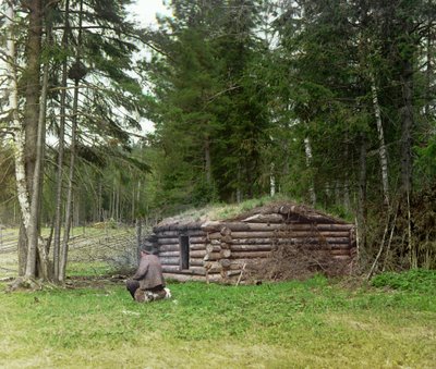 A Man in Front of a Hut for Woodcutters and Kuria (Coal Burning) in the Forest, Russian Empire, Between 1905 and 1915 by Sergey Prokudin Gorsky
