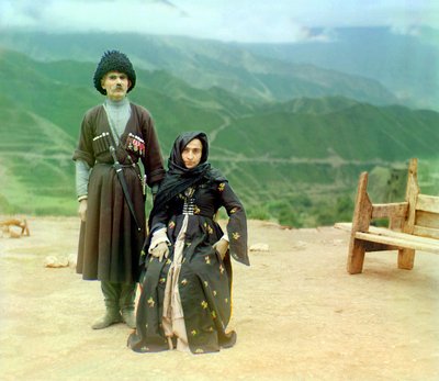 Dagestani Types – A Man with Medals and a Dagger and a Woman in Black Dress, Russian Empire by Sergey Prokudin Gorsky